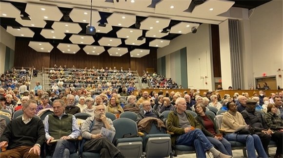 Residents attend Town Meeting in the Lincoln School Auditorium