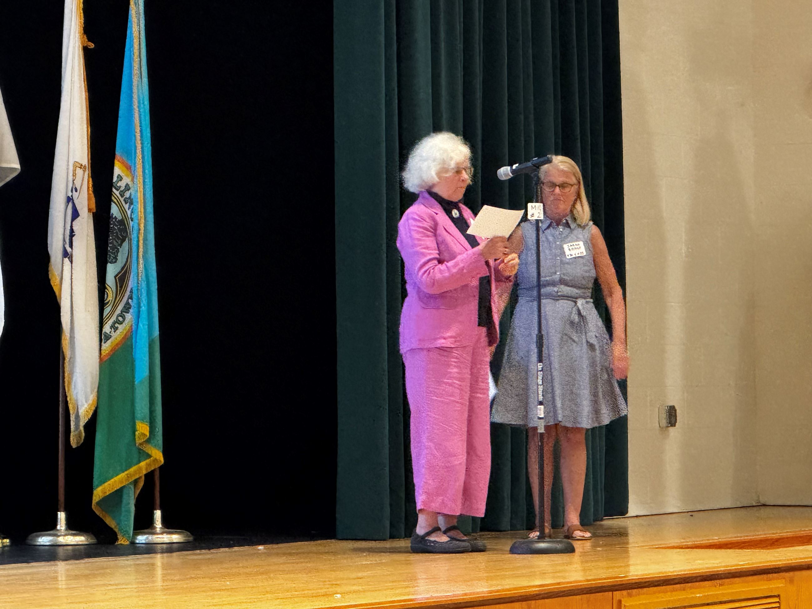 Community members take turns reading the U.S. Constitution.